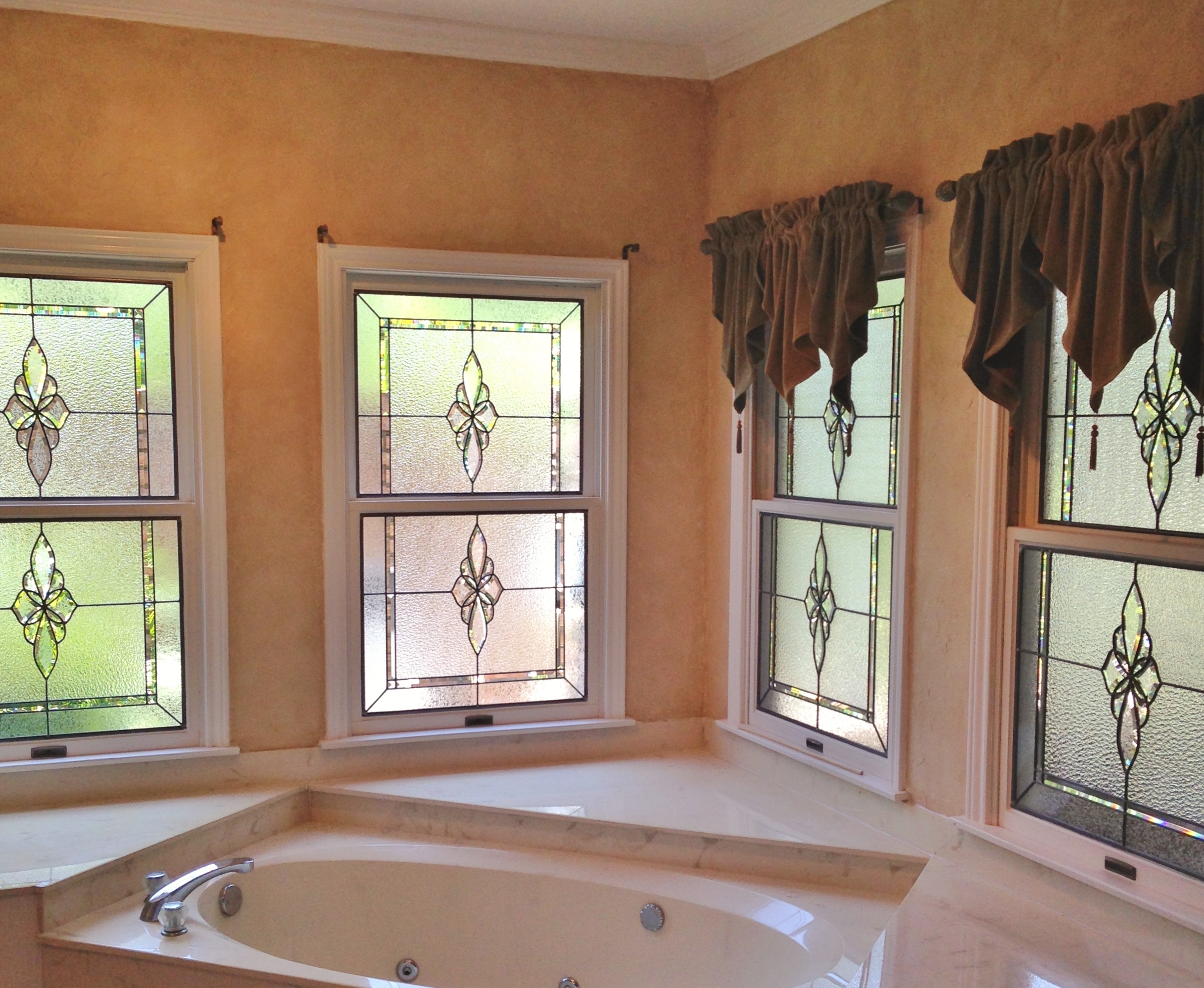 Antique stained glass bathroom in Houston with colorful light patterns