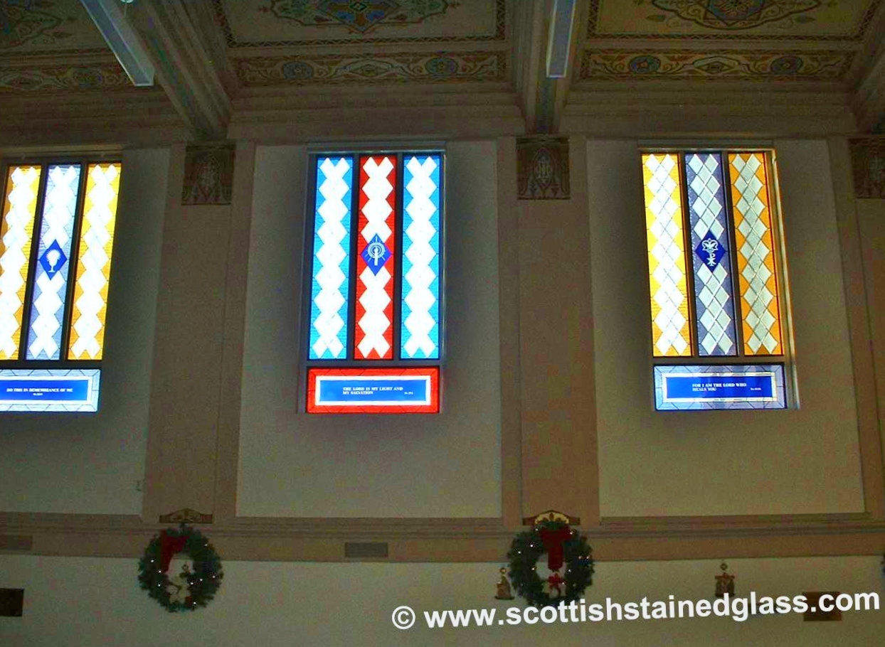 Antique church stained glass window in Houston with vibrant colors and intricate designs
