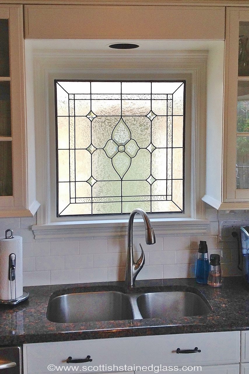 Houston kitchen with vibrant cabinet stained glass inserts